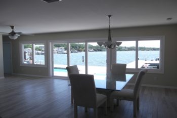 Plank style flooring tile with wood grain look in grey tones