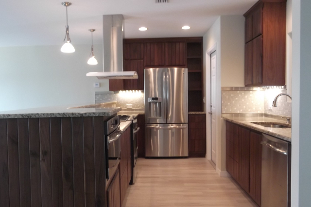 Kitchen remodel with reused cabinets, granite countertops end view