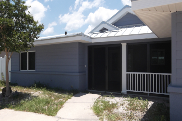 Front wall of remodeled house with walls of stucco and fiber cement siding