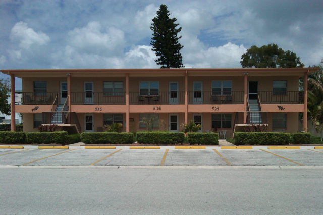 Front view of condo with painted stucco